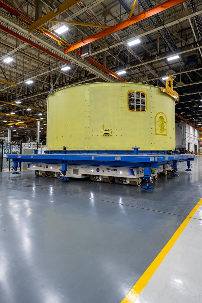 Crews at NASA’s Michoud Assembly Facility in New Orleans move the forward skirt of NASA’s Space Launch System (SLS) rocket to another part of the facility Dec. 15. Teams are preparing to apply the thermal protection system to the flight hardware, which will protect it from the extreme temperatures during launch and flight. The forward skirt is part of the core stage that will power the SLS rocket for the Artemis III mission. The forward skirt houses flight computers, cameras, and avionics.. The SLS core stage is made up of five unique elements: the forward skirt, liquid oxygen tank, intertank, liquid hydrogen tank, and the engine section. When fully stacked, the forward skirt is located at the top of the core stage and connects the stage to the upper part of the rocket. Together with its four RS-25 engines, the rocket’s massive 212-foot-tall core stage — the largest stage NASA has ever built — and its twin solid rocket boosters produce 8.8 million pounds of thrust to send NASA’s Orion spacecraft, astronauts and supplies beyond Earth’s orbit to the Moon and, ultimately, Mars. Offering more payload mass, volume capability and energy to speed missions through space, the SLS rocket, along with NASA’s Gateway in lunar orbit, the Human Landing System, and Orion spacecraft, is part of NASA’s backbone for deep space exploration and the Artemis lunar program. No other rocket is capable of carrying astronauts in Orion around the Moon in a single mission.